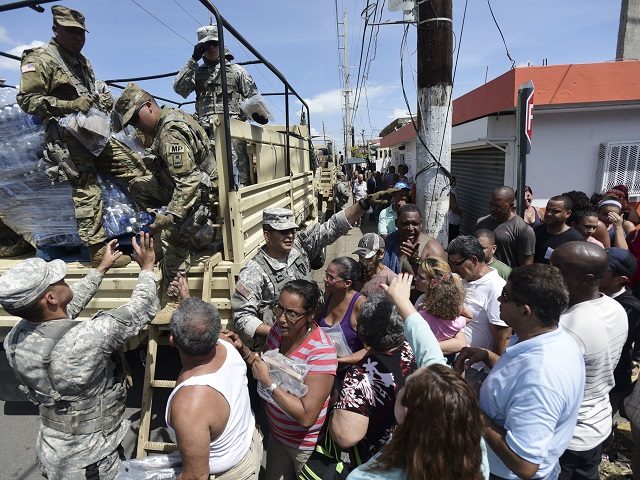 National Guardsmen arrive at Barrio Obrero in Santurce to distribute water and food among