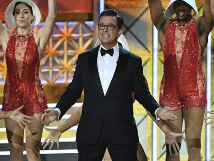 Host Stephen Colbert dances onstage during the 69th Emmy Awards at the Microsoft Theatre on September 17, 2017 in Los Angeles, California. / AFP PHOTO / Frederic J. Brown (Photo credit should read FREDERIC J. BROWN/AFP/Getty Images)