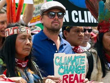 US actor Leonardo DiCaprio (2nd L) marches with a group of indigenous people from North an
