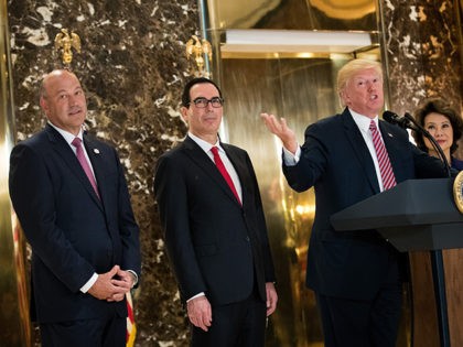 NEW YORK, NY - AUGUST 15: President Donald Trump delivers remarks following a meeting on infrastructure at Trump Tower, August 15, 2017 in New York City. Standing alongside him from L to R, Director of the National Economic Council Gary Cohn, Treasury Secretary Steve Mnuchin, and Transportation Secretary Elaine Chao. …