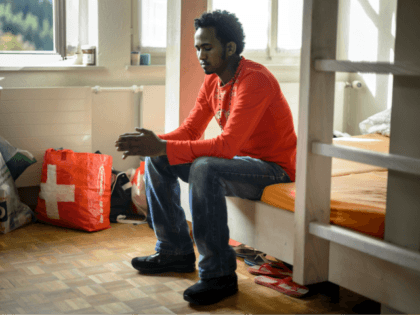TO GO WITH AFP STORY BY NINA LARSON An Eritrean asylum seeker sits in a dormitory at the E