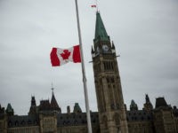 GettyImages-457726964 OTTAWA, ON - OCTOBER 23: A flag next to the Canadian Parliament Building is flown at half staff one day after Cpl. Nathan Cirillo of the Canadian Army Reserves was killed while standing guard in front of the National War Memorial by a lone gunman, on October 23, 2014 in …