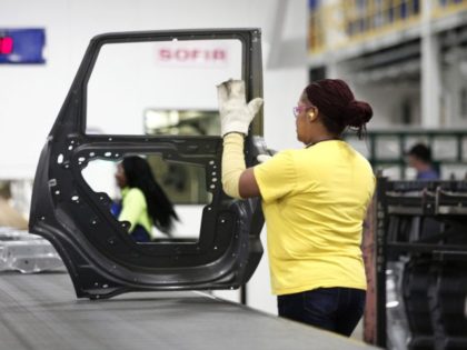 WARREN, MI - JANUARY 22: A worker handles a door that came out of the new $63 million pres