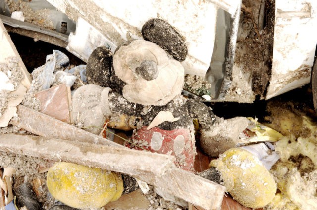 EVANSVILLE, IN - NOVEMBER 7: A damaged Mickey Mouse toy lies in the rubble and debris at