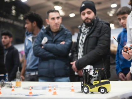 Visitors attend the second edition of a job fair for refugees and migrants on January 25,