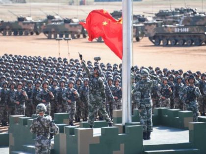 The Chinese flag is raised during a military parade at the Zhurihe training base in China'