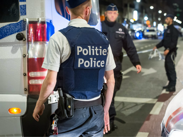 Policemen stand guard the Boulevard Emile Jacqmain in the city centre of Brussels on August 25, 2017, where a man is alleged to have attacked soldiers with a knife and was shot. A knife-wielding man attacked a soldier in Brussels on August 25, 2017, before being 'neutralised' by troops present …