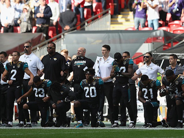 LONDON, ENGLAND - SEPTEMBER 24: Jacksonville Jaguar players show their protest during the