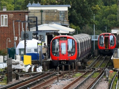 A forensic tent is seen next to the stopped tube train at Parsons Green Underground Statio