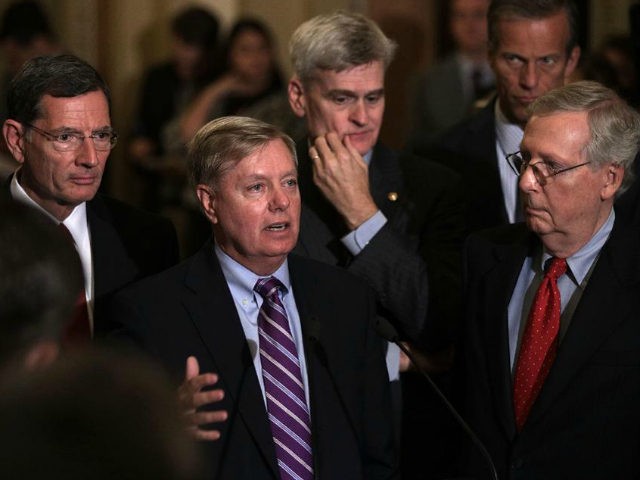 WASHINGTON, DC - SEPTEMBER 19: U.S. Sen. Lindsey Graham (R-SC) (2nd L) speaks as (L-R) Sen. John Barrasso (R-WY), Sen. Bill Cassidy (R-LA), Sen. John Thune (R-SD), and Senate Majority Leader Sen. Mitch McConnell (R-KY) listen during a news briefing after the weekly Senate Republican policy luncheon at the Capitol …