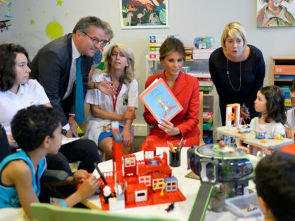 First Lady Melania Trump speaks with children as she visits Necker Hospital for children o