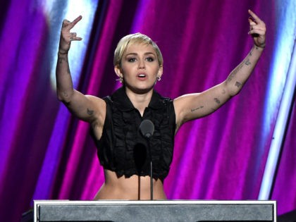 Miley Cyrus speaks onstage during the 30th Annual Rock And Roll Hall Of Fame Induction Ceremony at Public Hall on April 18, 2015 in Cleveland, Ohio. (Photo by Mike Coppola/Getty Images)