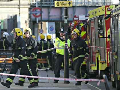 Members of the emergency services work outside Parsons Green underground tube station in w