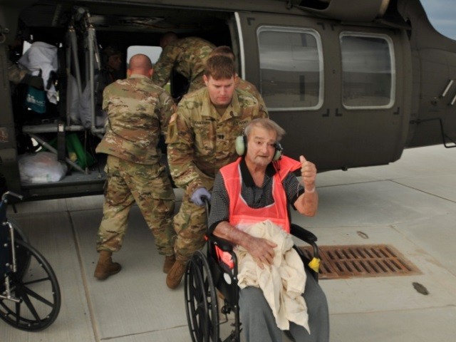 Army Reservists rescue elderly patients from Port Arthur nursing home. (U.S. Army Photo: Captain Matthew Roman)