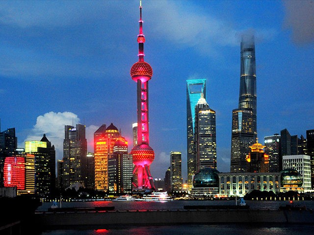 SHANGHAI, CHINA - AUGUST 09: Shanghai's symbolic Oriental Pearl TV Tower lights up in