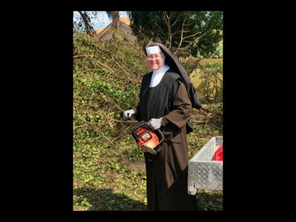 Sister Margaret Ann, dressed in a full habit, was spotted using a chainsaw to clear brush from the fallen debris following Hurricane Irma’s destruction in Miami, Florida, according to a video captured by an off-duty police officer.