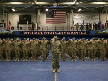 U.S. Army soldiers salute during a welcome-home ceremony after from Iraq on May 17, 2016 at Fort Drum, New York. More than 1,000 members of the 10th Mountain Division 1st Brigade Combat Team are returning home after a 9-month deployment in Iraq as part of Operation Inherent Resolve to train …