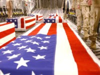UNDATED: Caskets bearing the remains of U.S. servicemen are shown in the cargo hold of a transport plane in this undated handout photo released April 28, 2005 by the Pentagon. The release this week of more than 700 images showing the return of American casualties to Dover Air Force Base …