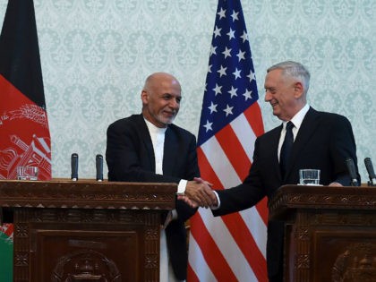 US Defense Secretary Jim Mattis (R) shakes hands with Afghan President Ashraf Ghani after a press conference at the Presidential Palace in Kabul on September 27, 2017. US Defense Secretary Jim Mattis and NATO chief Jens Stoltenberg renewed their commitment to Afghanistan on September 27, as the Taliban launched a …