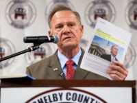 alabama-judge-roy-moore-holds-article-on-mitch-mcconnell-getty UNITED STATES - AUGUST 4: GOP candidate for U.S. Senate Roy Moore, holding an article about Senate Majority Leader Mitch McConnell, R-Ky., speaks during the U.S. Senate candidate forum held by the Shelby County Republican Party in Pelham, Ala., on Friday, Aug. 4, 2017. The former Chief Justice of the …