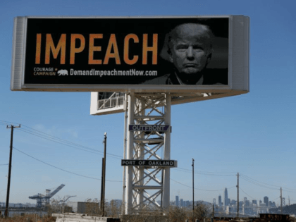 OAKLAND, CA - SEPTEMBER 25: An electronic billboard next to the San Francisco-Oakland Bay Bridge reads 'IMPEACH' with an image of U.S. President Donald Trump on September 25, 2017 in Oakland, California. The Courage Campaign commissioned an electronic billboard calling for the impeachment of U.S. President Donald Trump alongside Interstate …