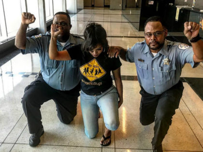 Chicago Police Officers Reprimanded After Photo of Them Kneeling on Duty Circulates Internet