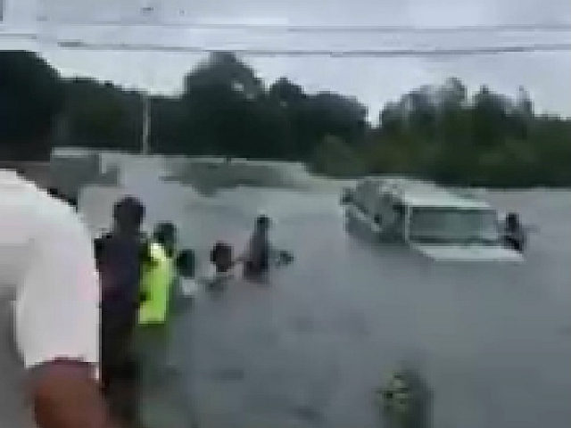 Drivers Form Human Chain to Rescue Elderly Man Caught in Houston Floodwaters in Hurricane Harvey.