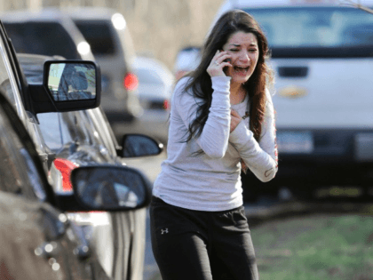 FILE - In this Dec. 14, 2012 file photo, Carlee Soto uses a phone to get information about her sister, Victoria Soto, a teacher at the Sandy Hook Elementary School in Newtown, Conn., after gunman Adam Lanza killed 26 people inside the school, including 20 children. Victoria Soto, 27, was …