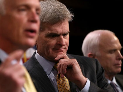 WASHINGTON, DC - JULY 27: U.S. Sen. Bill Cassidy (R-LA) looks on at a news conference, alo