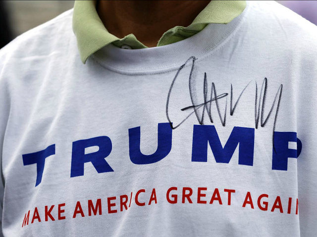 FILE - In this Aug. 29, 2015, file photo, Donald Trump supporter John Wang wears a shirt a