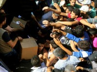 syrian-refugees-aid-lebanon-2016-getty Members of Secours populaire, a French non-profit association deliver food aid to Syrian refugees in the village of Al-Aqibiya near Sidon in Southern Lebanon on June 6, 2016. / AFP / MAHMOUD ZAYYAT (Photo credit should read MAHMOUD ZAYYAT/AFP/Getty Images)