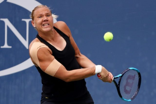 Kaia Kanepi of Estonia returns a shot during her third round match against Naomi Osaka of