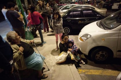 Residents gather on a street in Mexico City on September 7, 2017, after an earthquake of magnitude 8.1 struck the south and was felt as far away as the capital