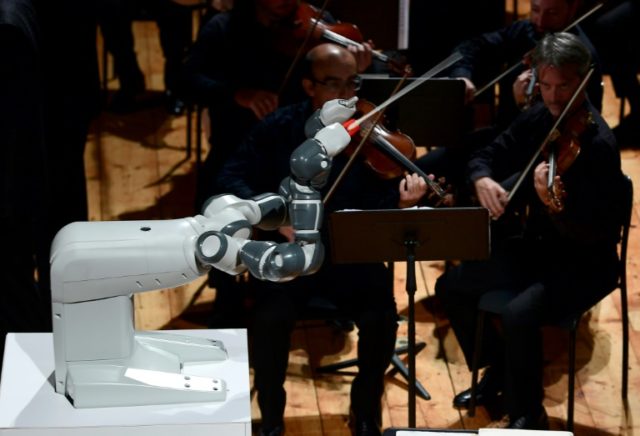 YuMi, designed by Switzerland's ABB, conducts the Lucca Philharmonic Orchestra on Tuesday