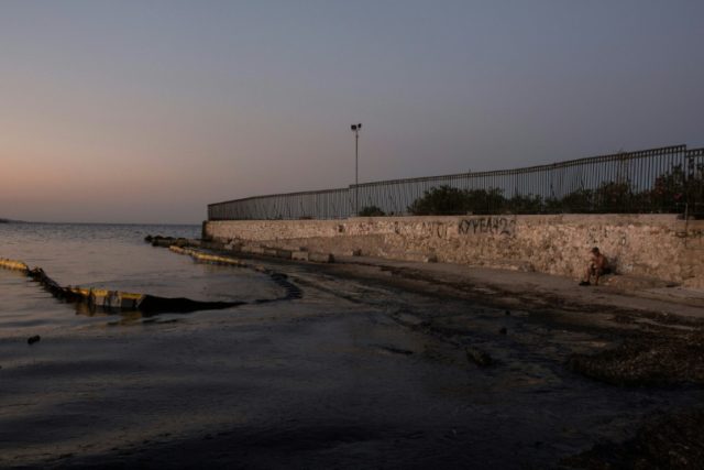 An oily sea on a beach near Athens, five days after the sinking of a tanker, has triggered