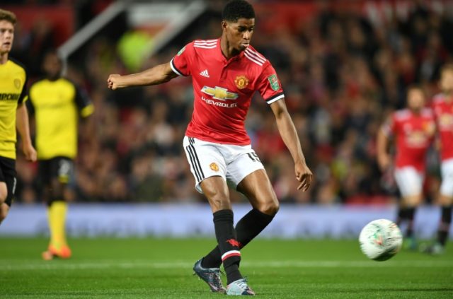 Manchester United's Marcus Rashford scores the opening goal during their match against Bur