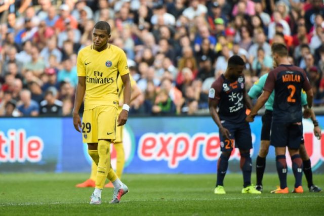 Paris Saint-Germain forward Kylian Mbappe (L) reacts during the French Ligue 1 football ma