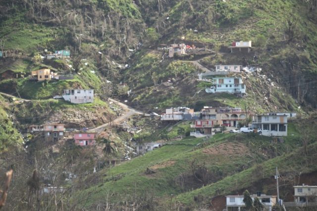 Damaged homes and vegetation during the passage of Hurricane Maria are viewed on a mountai
