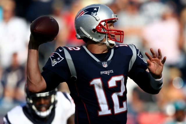 Tom Brady of the New England Patriots makes a pass against the Houston Texans at Gillette