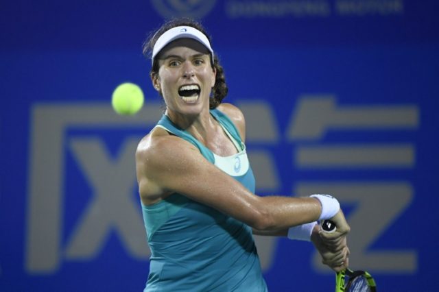 Johanna Konta of Great Britain hits a return against Ashleigh Barty of Australia during th