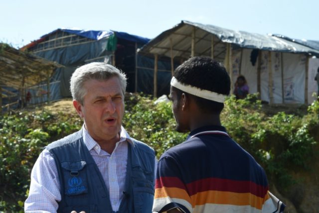 UN refugee chief Filippo Grandi talks with a refugee during a visit to Bangladesh's Kutupa