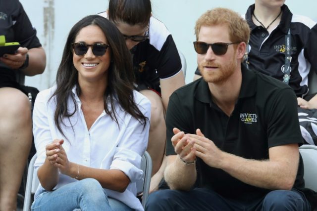 Prince Harry and girlfriend Meghan Markle attend a wheelchair tennis match during the Invi