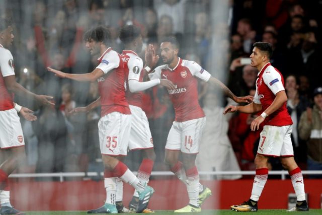 Arsenal's Alexis Sanchez (R) celebrates with teammates after scoring a goal during their U