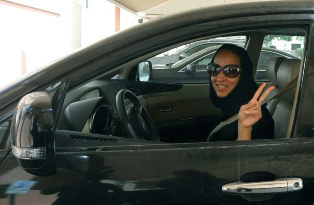 This picture from October 22, 2013 shows Saudi activist Manal al-Sharif behind the wheel i