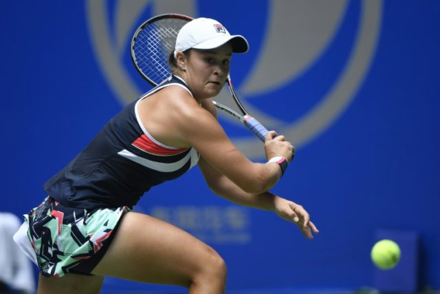Ashleigh Barty of Australia hits a return against Agnieszka Radwanska of Poland during the