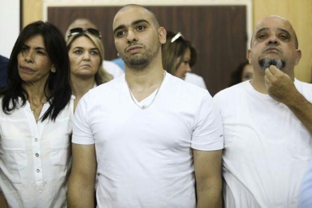 Israeli soldier Elor Azaria (C) was convicted in a military trial that deeply divided the