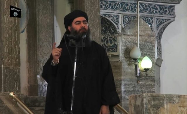 Islamic State leader Abu Bakr al-Baghdadi addressing Muslim worshippers at a mosque in the