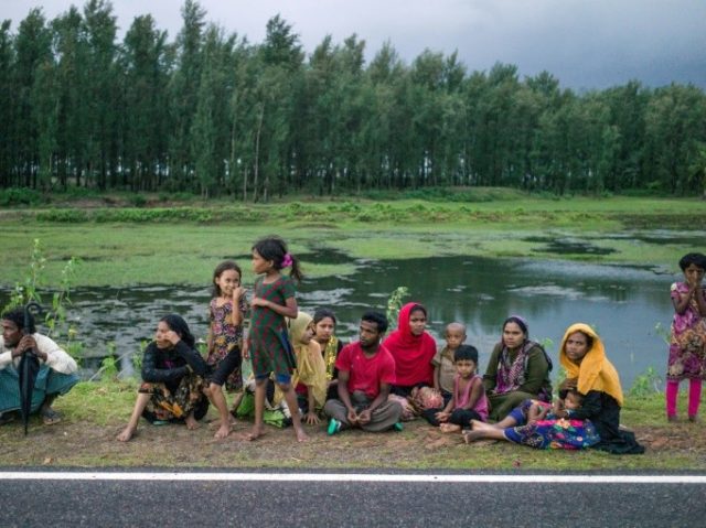 Rohingya Muslim refugees wait on a road in Bangladesh's Ukhia district on September 28, 20