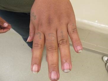 Salvadoran woman displays MS-13 tattoos on her hand after being arrested after illegally crossing border in South Texas. (Photo: U.S. Border Patrol)
