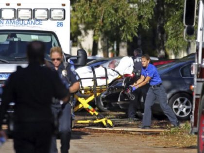Ambulance worker evacuates elderly patient from Florida nursing home. (AP Photo/Beth Benne